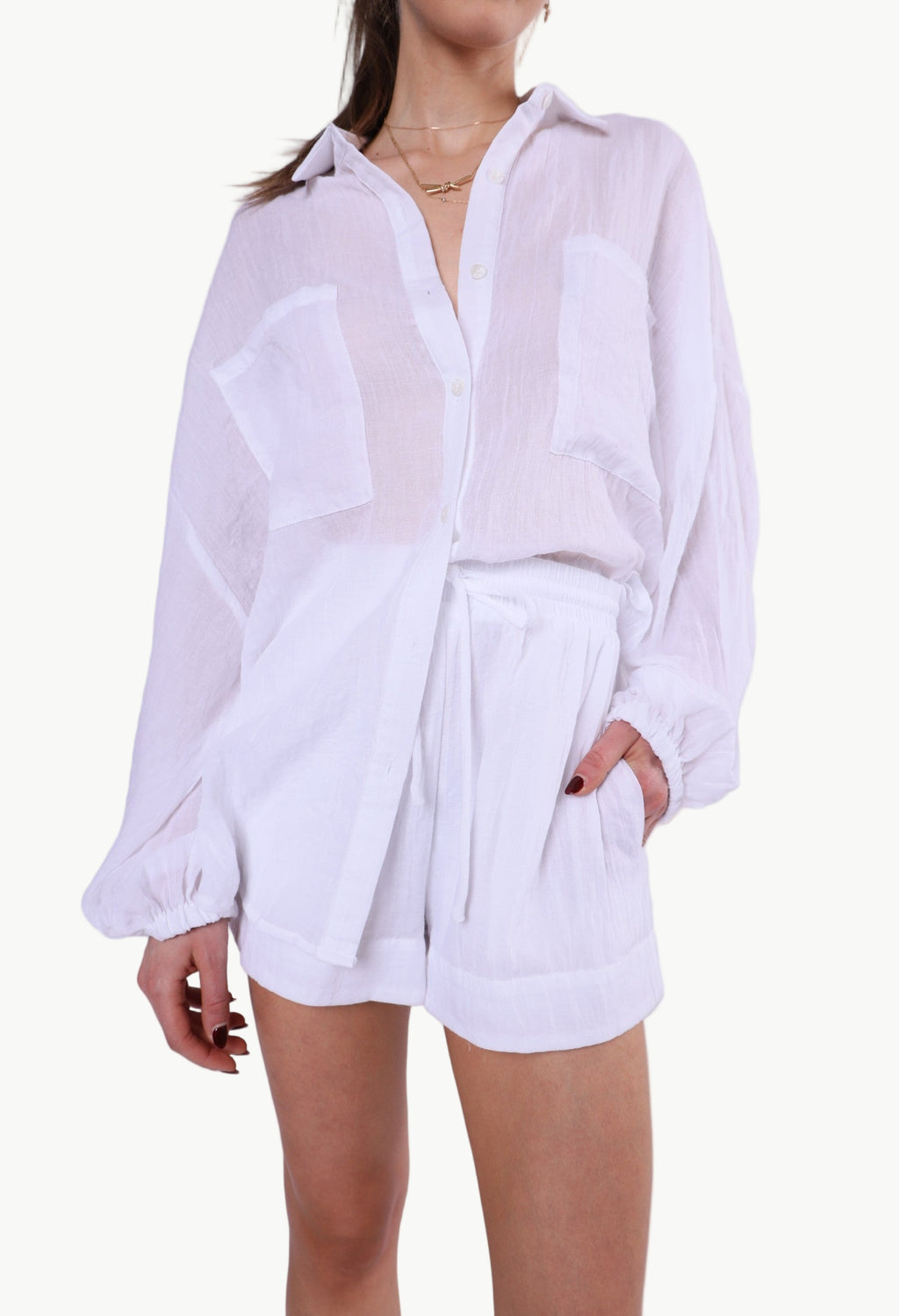 La Libéré model Person wearing a white button-up shirt and shorts set on a plain background