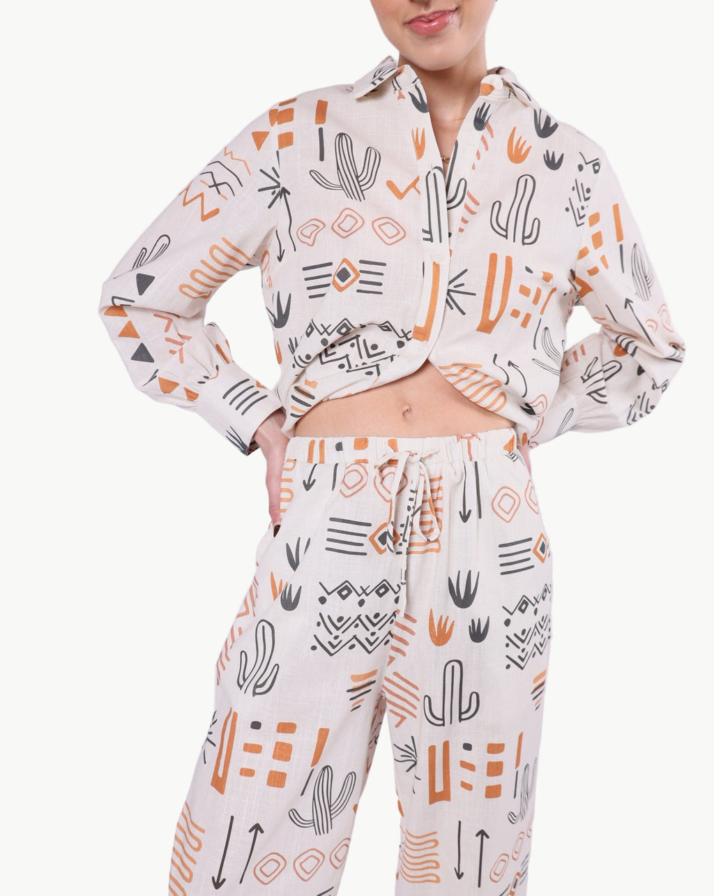 La Libéré Model  wearing a patterned outfit with cactus design on a plain background