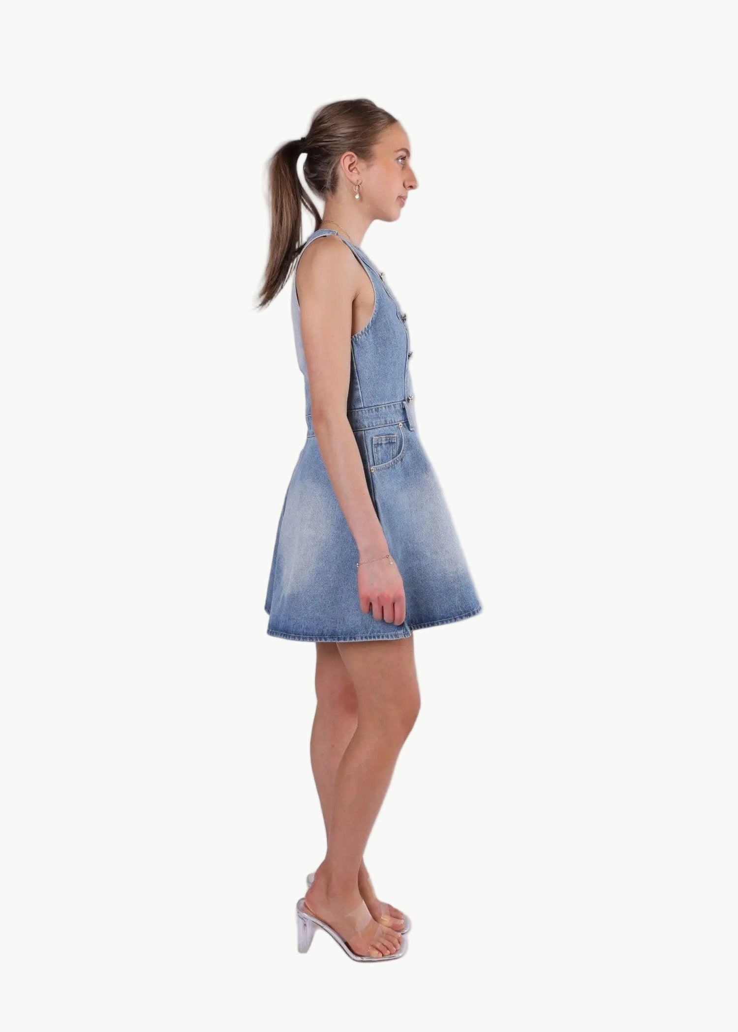 La Libéré model  wearing a denim dress against a white background