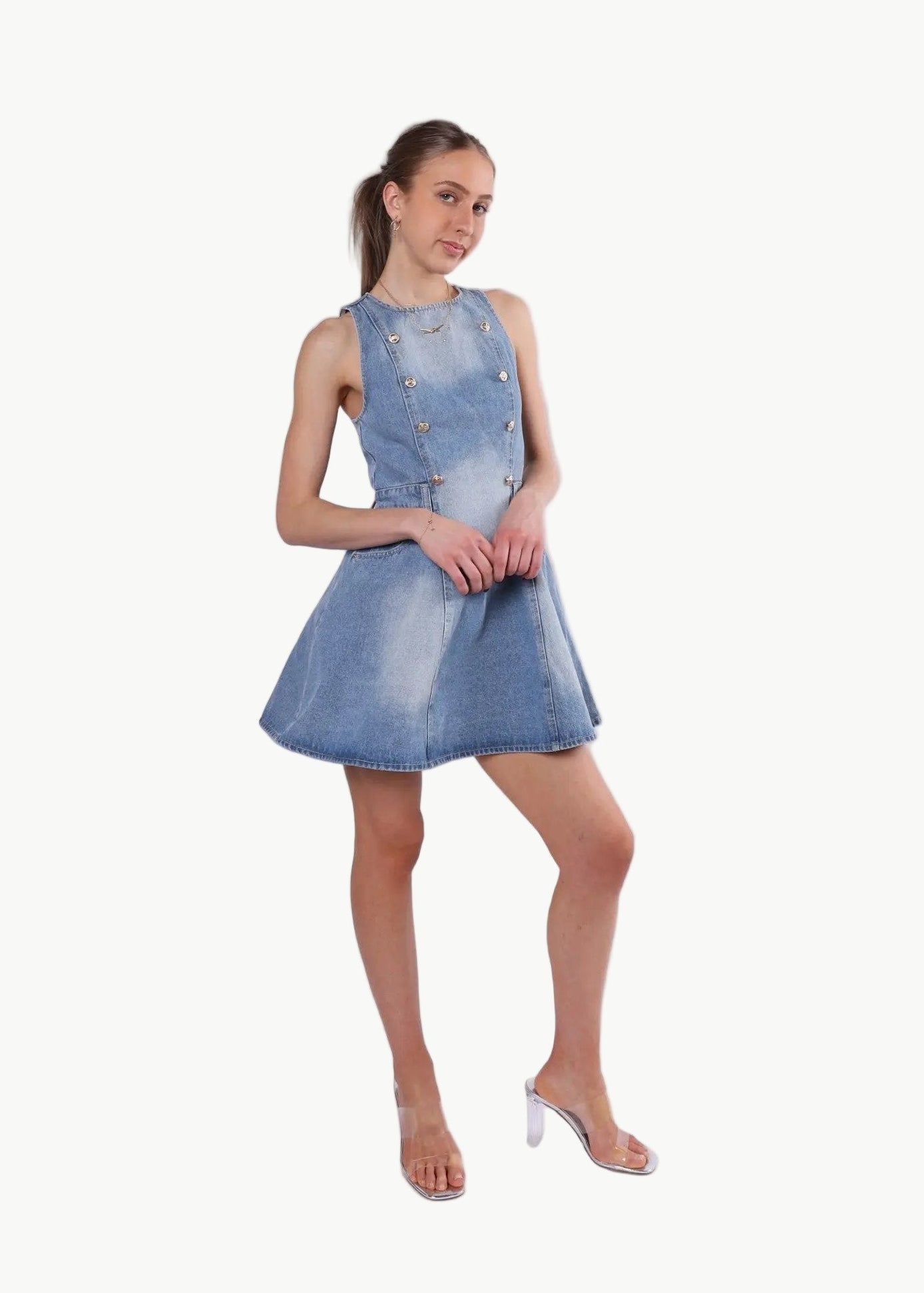 La Libéré model  wearing a denim dress on a white background