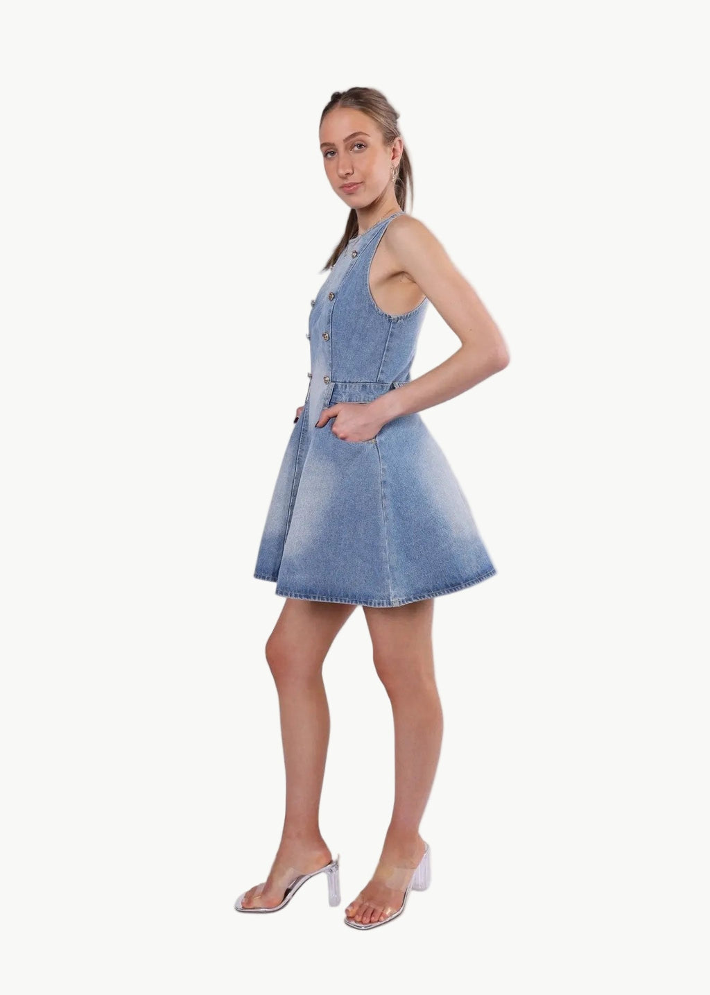 La Libéré model  wearing a denim dress on a white background